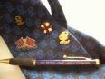 Postcards, Pens, Pins & Ties